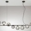 Große Pendelleuchte HONEY 8-flammig Schwarz-Glaskugeln Rauchglas, Breite 145cm
