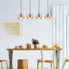 LED Pendelleuchte 4-flammig mit Rauchglas und Messing lang, Breite 111cm