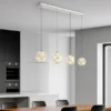 LED Pendelleuchte VIRINA 4-flammig Silber mit Kristall Glaskugeln, Breite 93cm